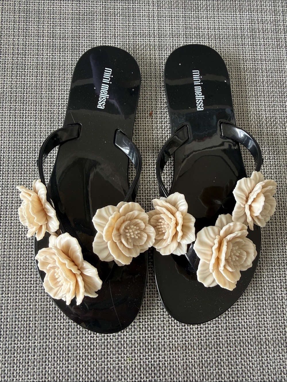 Mini Melissa Black Jelly Flip-Flops with Cream Floral Appliqués